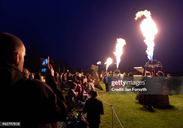 Night glow using hot air balloon burners ignited in time to music takes place during the Durham Hot Air Balloon Festival on May 26, 2018 in Durham,...