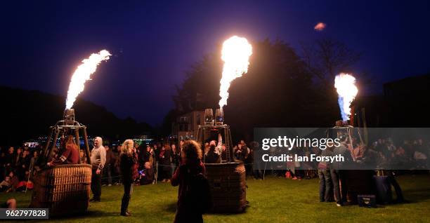 Night glow using hot air balloon burners ignited in time to music takes place during the Durham Hot Air Balloon Festival on May 26, 2018 in Durham,...