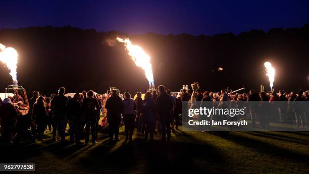 Night glow using hot air balloon burners ignited in time to music takes place during the Durham Hot Air Balloon Festival on May 26, 2018 in Durham,...