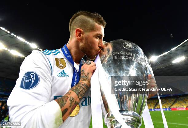 Sergio Ramos of Real Madrid celebrates with The UEFA Champions League trophy following his sides victory in the UEFA Champions League Final between...