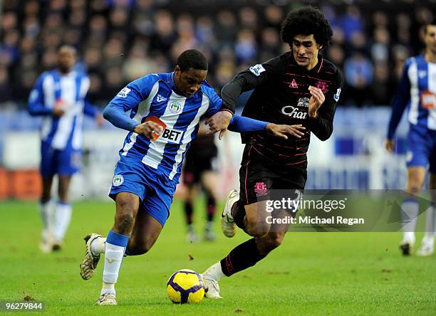 Marouane Fellaini of Everton challenges Charles N'Zogbia of Wigan during the Barclays Premier League match between Wigan Athletic and Everton at the...