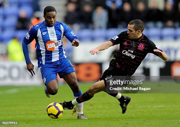 Leon Osman of Everton challenges Charles N'Zogbia of Wigan during the Barclays Premier League match between Wigan Athletic and Everton at the DW...