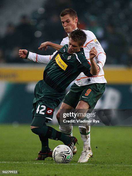 Markus Rosenberg of Bremen and Patrick Herrmann of Moenchengladbach battle for the ball during the Bundesliga match between Borussia Moenchengladbach...