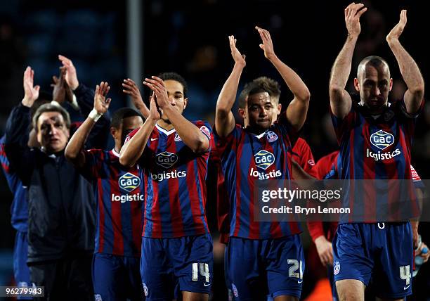 The Crystal Palace team and Manager Neil Warnock applaud their fans after winning the Coca-Cola Football League Championship match between Crystal...