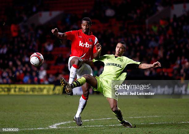 Jose Semedo of Charlton Athletic is tackled by Shaleum Logan of Tranmere Rovers during the Coca Cola League One match between Charlton Athletic and...