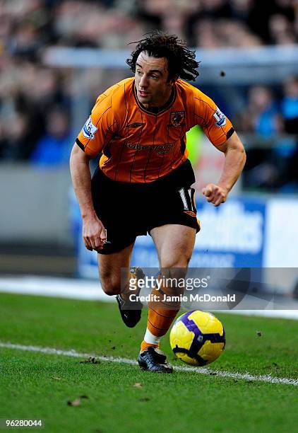 Stephen Hunt of Hull City runs with the ball during the Barclays Premier League match between Hull City and Wolverhampton Wanderers at KC Stadium on...