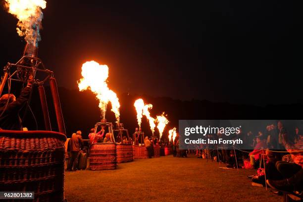 Night glow using hot air balloon burners ignited in time to music takes place during the Durham Hot Air Balloon Festival on May 26, 2018 in Durham,...