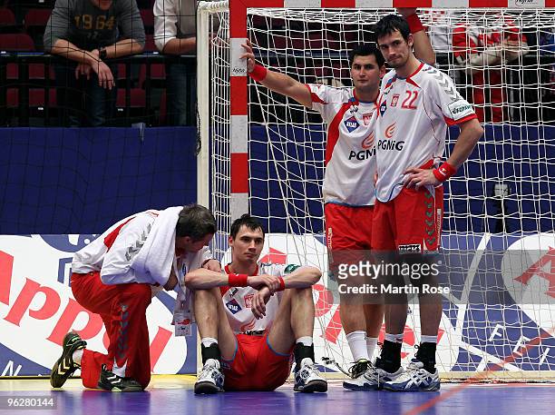 Bogdan Wenta , head coach of Poland comforts Krysztof Lijewski after the Men's Handball European semi final match between Croatia and Poland at the...
