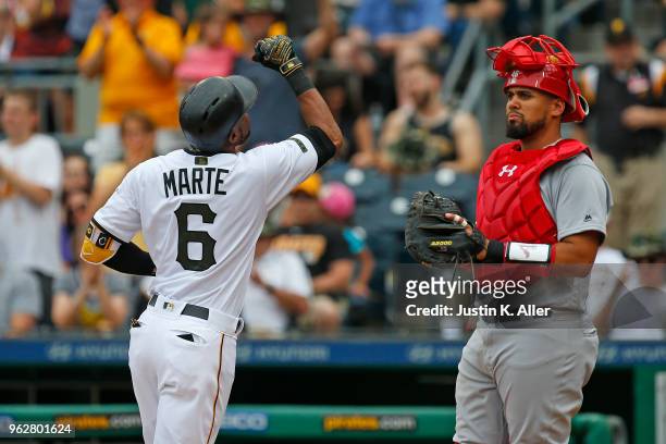 Starling Marte of the Pittsburgh Pirates reacts after hitting a home run in the first inning against the St. Louis Cardinals at PNC Park on May 26,...