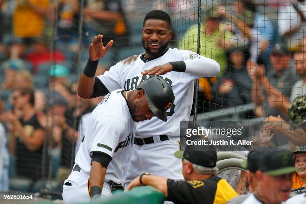 Starling Marte of the Pittsburgh Pirates celebrates with Gregory Polanco after hitting a home run in the first inning against the St. Louis Cardinals...