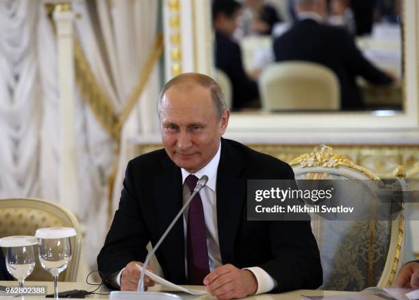 Russian President Vladimir Putin attends a meeting with foreign investors at the 2018 Saint Petersburg International Economic Forum on May 24, 2018...