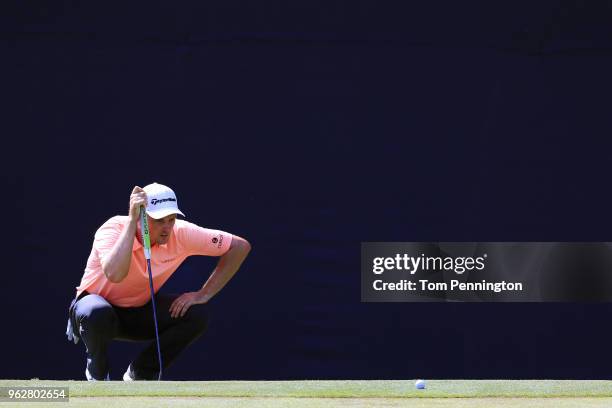 Justin Rose of England lines up a putt on the 17th green during round three of the Fort Worth Invitational at Colonial Country Club on May 26, 2018...