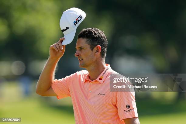 Justin Rose of England reacts after his putt on on the 18th green during round three of the Fort Worth Invitational at Colonial Country Club on May...