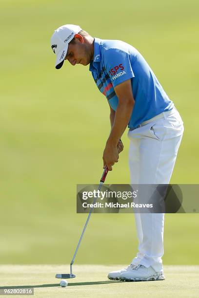 Emiliano Grillo of Argentina putts on the 18th green during round three of the Fort Worth Invitational at Colonial Country Club on May 26, 2018 in...