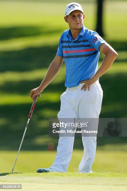 Emiliano Grillo of Argentina reacts after missing a putt on the 18th green during round three of the Fort Worth Invitational at Colonial Country Club...