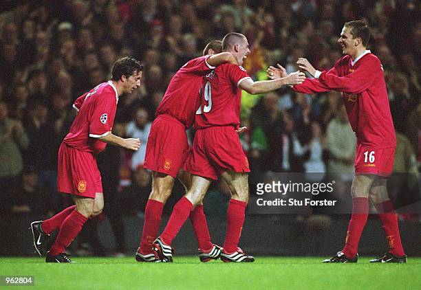 Stephen Wright of Liverpool celebrates with team-mates after scoring his first goal for the club during the UEFA Champions League Group B match...