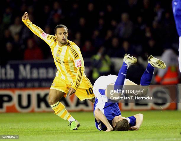 Wayne Routledge upends Andy King during during the Coca-Cola championship match between Leicester City and Newcastle United at The Walkers Stadium on...