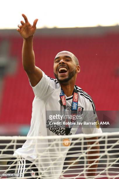 Denis Odoi of Fulham celebrates on top of the goal posts at full time during the Sky Bet Championship Play Off Final between Aston Villa and Fulham...