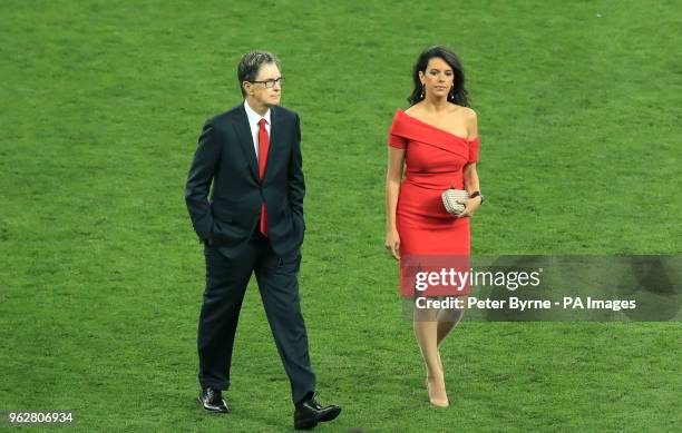 Liverpool owner John W. Henry and wife Linda Pizzuti Henry on the pitch after the UEFA Champions League Final at the NSK Olimpiyskiy Stadium, Kiev.