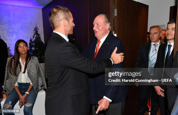 President Aleksander Ceferin speaks to Juan Carlos I of Spain during the UEFA Champions League Final between Real Madrid and Liverpool at NSC...