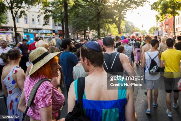 Guy wearing a kippa attends a Tuntenpaziergang to protest against homophobia and for LGBTI rights and diversity in Berlin Neukoelln on May 26, 2018.