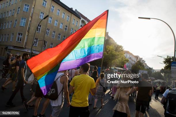 People attend a Tuntenpaziergang to protest against homophobia and for LGBTI rights and diversity in Berlin Neukoelln on May 26, 2018.