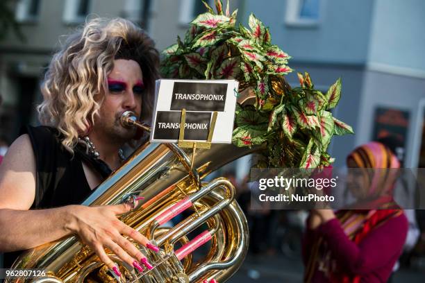 People attend a Tuntenpaziergang to protest against homophobia and for LGBTI rights and diversity in Berlin Neukoelln on May 26, 2018.