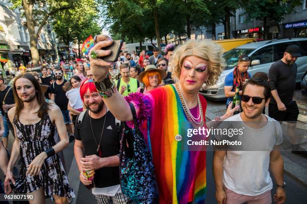 People attend a Tuntenpaziergang to protest against homophobia and for LGBTI rights and diversity in Berlin Neukoelln on May 26, 2018.