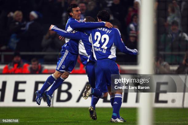 Lukas Schmitz of Schalke celebrates with team mates Vicente Sanchez and Kevin Kuranyi after scoring the second goal during the Bundesliga match...