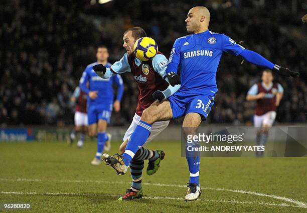 Burnley's Scottish forward Steven Fletcher beats Chelsea's Brazilian defender Alex to the ball to score the equalizing goal during the English...