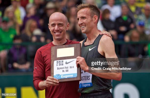 Riley Masters of the USA poses with Alan Webb of the USA after becoming the 500th person to run a sub 4:00 mile during the 2018 Prefontaine Classic...
