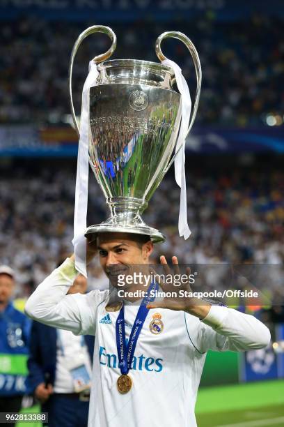 Cristiano Ronaldo of Real poses with the trophy on his head after the UEFA Champions League Final match between Real Madrid and Liverpool at the NSC...