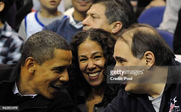 President Barack Obama , Mona Sutphen , White House Deputy Chief of Staff for Policy, and Senior Advisor David Axelrod attend the game between the...