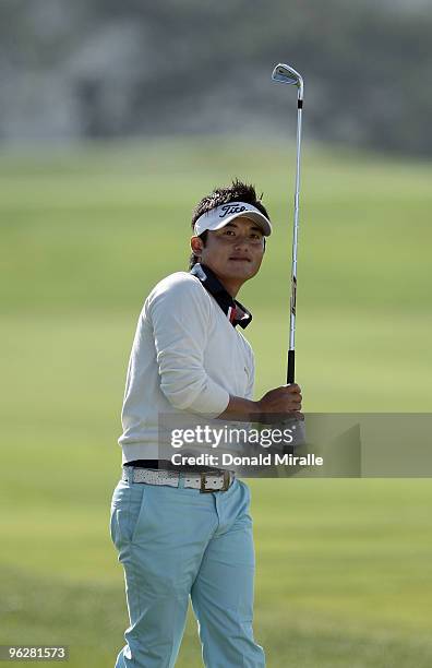 Ryuji Imada of Japan hits out of the rough on the 4th fairway during the third round of the 2010 Farmers Insurance Open on January 30, 2010 at Torrey...