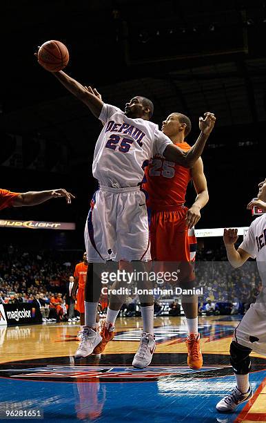 Eric Wallace of the DePaul Blue Demons grabs a rebound in front of Brandon Triche of the Syracuse Orange at the Allstate Arena on January 30, 2010 in...