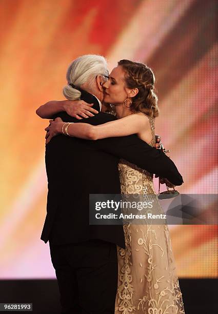 Actress Diane Kruger recieves the award for 'Best Actress International' from designer Karl Lagerfeld during the Goldene Kamera 2010 Award at the...