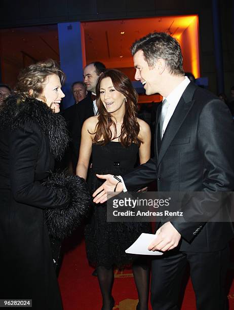 Host Barbara Schoeneberger greets presenter Marcus Lanz and partner Angela Gessmann during the Goldene Kamera 2010 Award at the Axel Springer Verlag...