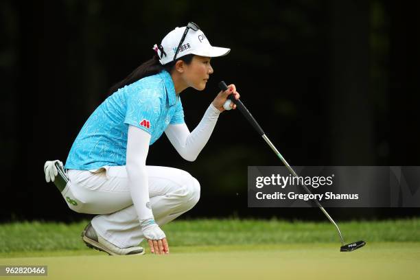 Ayako Uehara of Japan reads a putt on the sixth green during the third round of the LPGA Volvik Championship on May 26, 2018 at Travis Pointe Country...