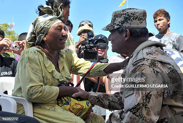 Colombian General Commander of the Military Forces Freddy Padilla greets a Colombian Wayuu indigenous woman during a meeting between the army and...
