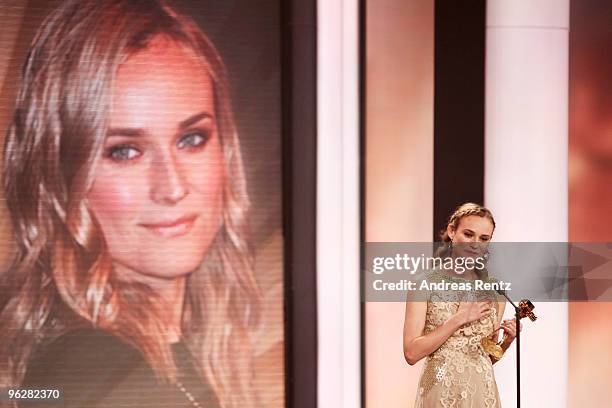 Actress Diane Kruger recieves the award for 'Best Actress International' from designer Karl Lagerfeld during the Goldene Kamera 2010 Award at the...