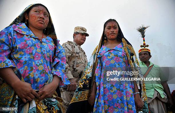 Colombian General Commander of the Military Forces Freddy Padilla walks next to Colombian Wayuu indigenous people during a meeting between the army...