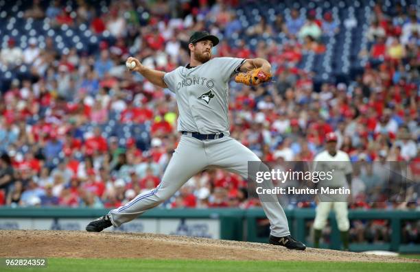 Joe Biagini of the Toronto Blue Jays throws a pitch in the eighth inning during a game against the Philadelphia Phillies at Citizens Bank Park on May...