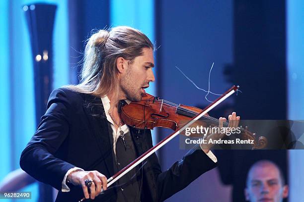 David Garrett performs after recieving the award for 'Best Music International' during the Goldene Kamera 2010 Award at the Axel Springer Verlag on...