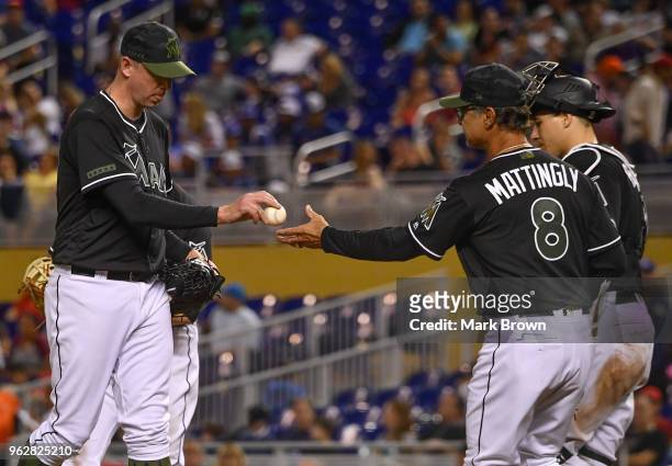 Don Mattingly of the Miami Marlins visits the mound to remove Brad Ziegler from the game during the ninth inning against the Washington Nationals at...