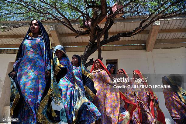 Colombian Wayuu indigenous women dance during a meeting between the army and villagers of the town of Uribia, in La Guajira Department, close to the...