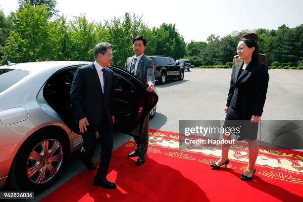 In this handout image provided by South Korean Presidential Blue House, South Korean President Moon Jae-in arrives as Kim Yo-Jong , sister of North...