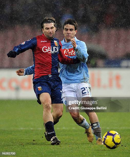 Omar Milanetto of Genoa and Luca Cigarini of Napoli in action during the Serie A match between Napoli and Genoa at Stadio San Paolo on January 30,...