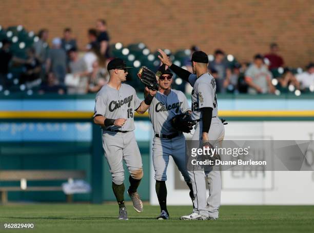 Adam Engel of the Chicago White Sox celebrates with Charlie Tilson of the Chicago White Sox and Trayce Thompson of the Chicago White Sox after an 8-4...