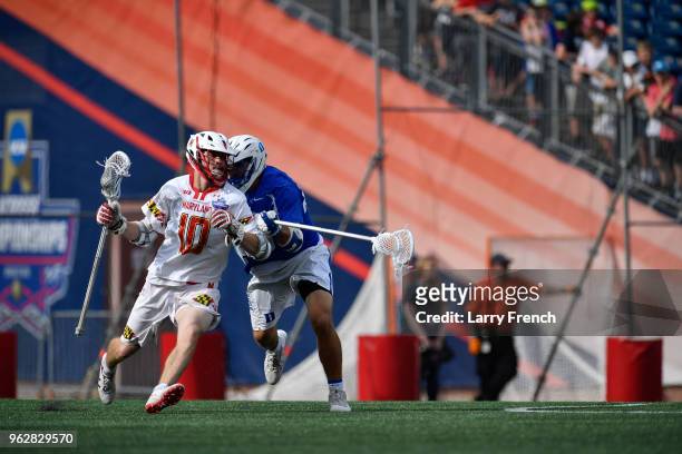University of Maryland middle Jared Bernhardt runs past Duke University defender Kevin McDonough during the teams' NCAA Photos via Getty Images Men's...
