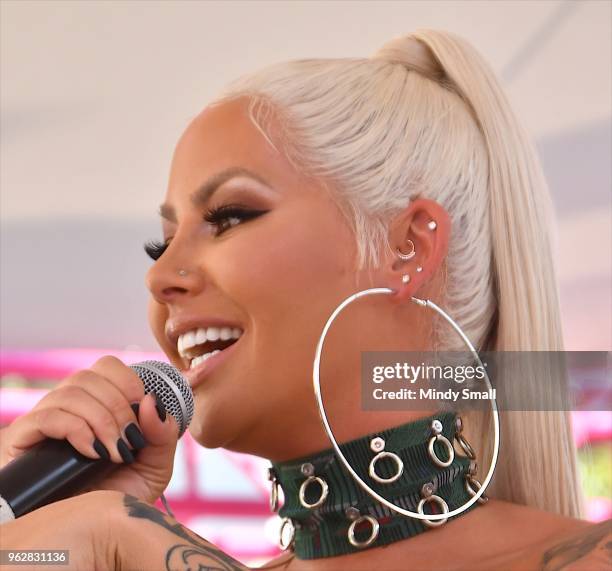 Model/actress Amber Rose, earring detail, speaks to guests at the Flamingo Go Pool Dayclub at Flamingo Las Vegas on May 26, 2018 in Las Vegas, Nevada.